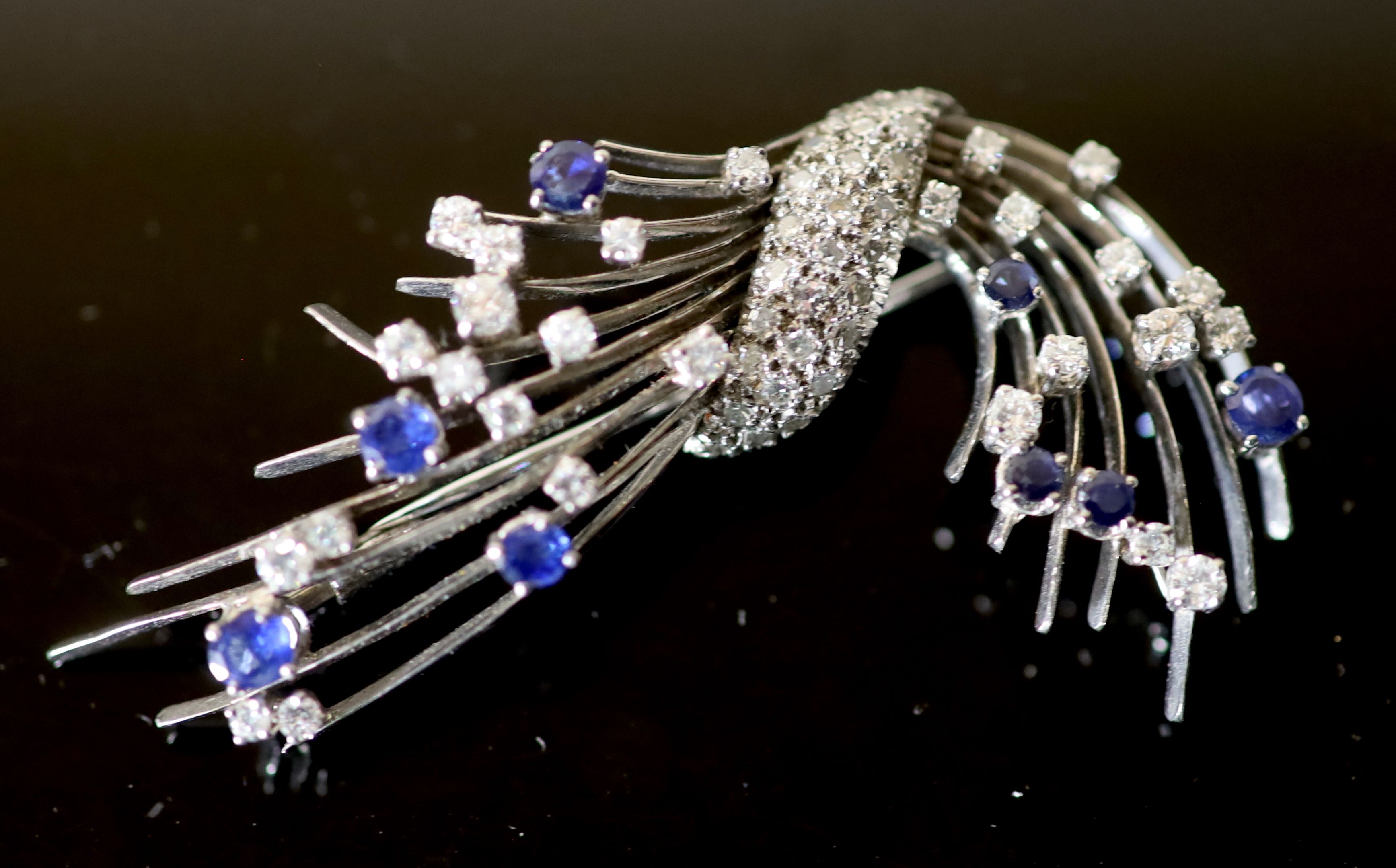 A platinum?, diamond and sapphire set spray brooch,